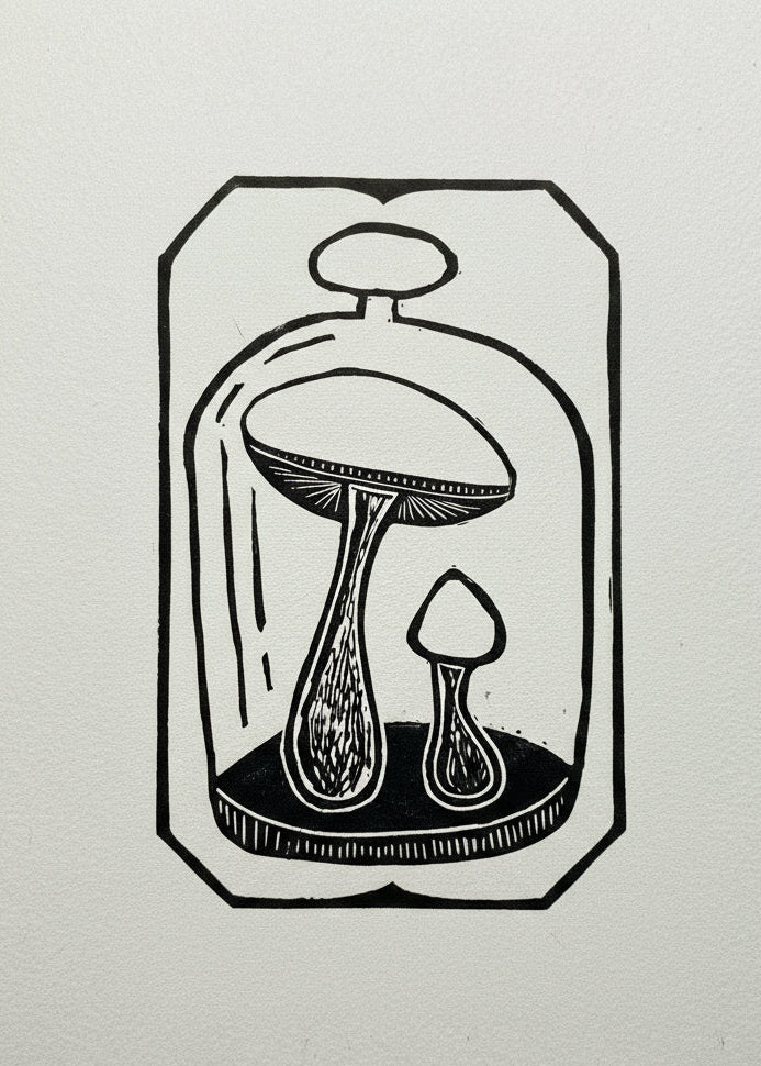 Linoprint of two Death Cap Mushrooms beneath glass