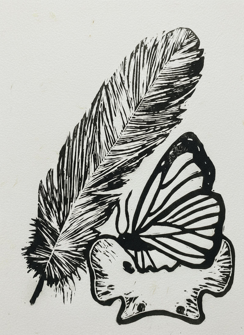 Linocut of a feather and a butterfly on a coyote vertebrae  on a white background
