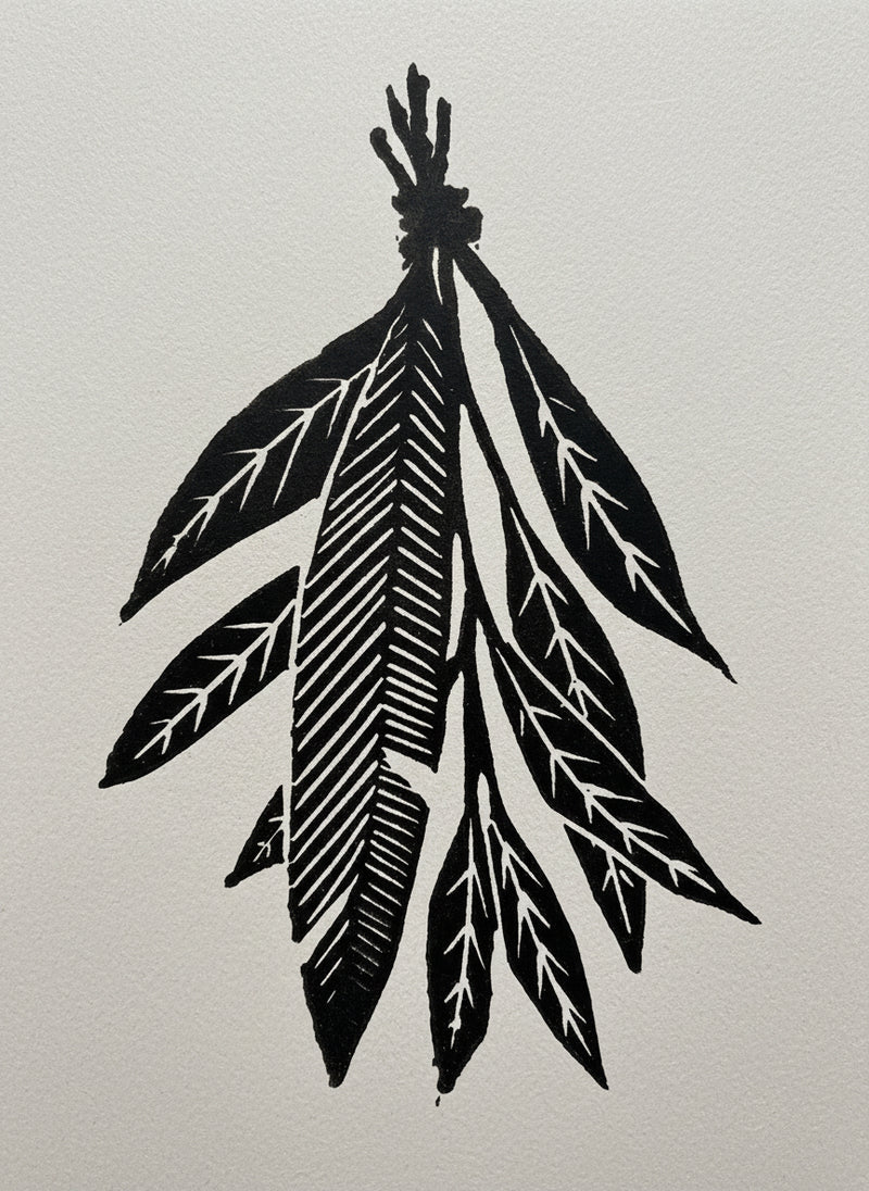 A sage and feather bundle